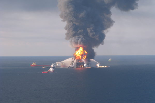 deepwater horizon on fire boats spraying water on fire zoomed out